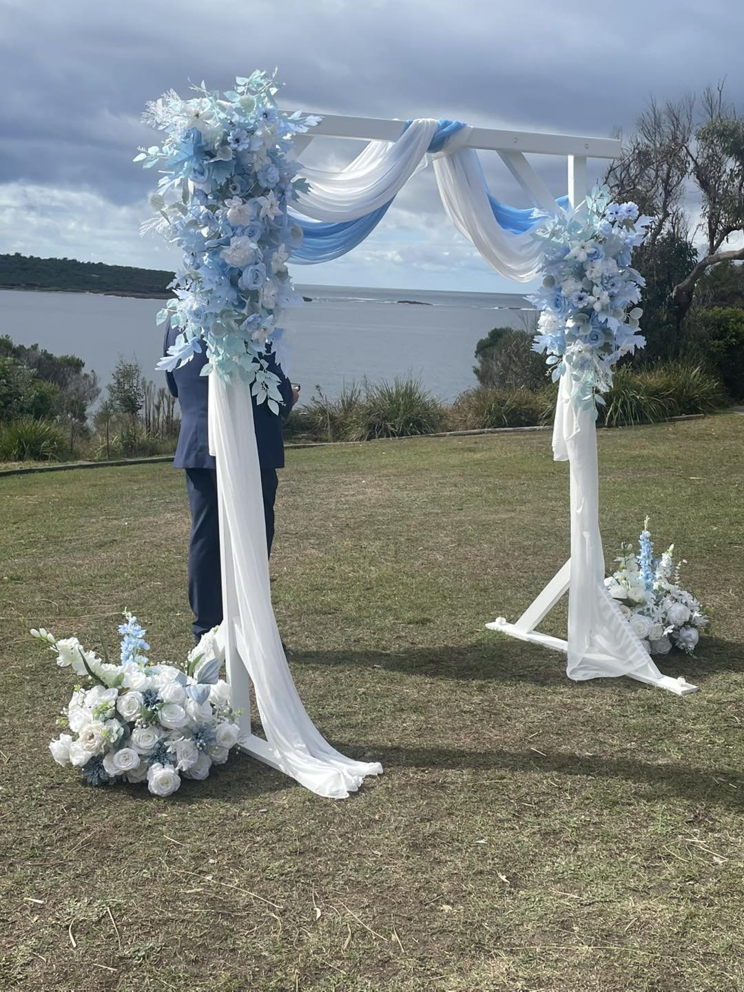 Coastal arch with blue and white draping