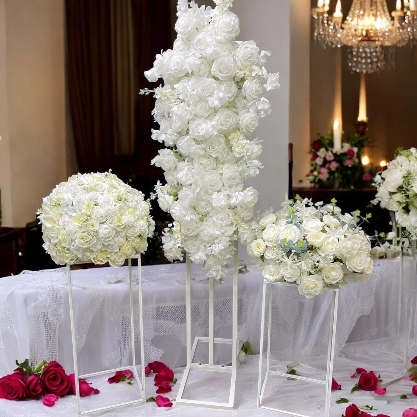White rose floral display on plinths
