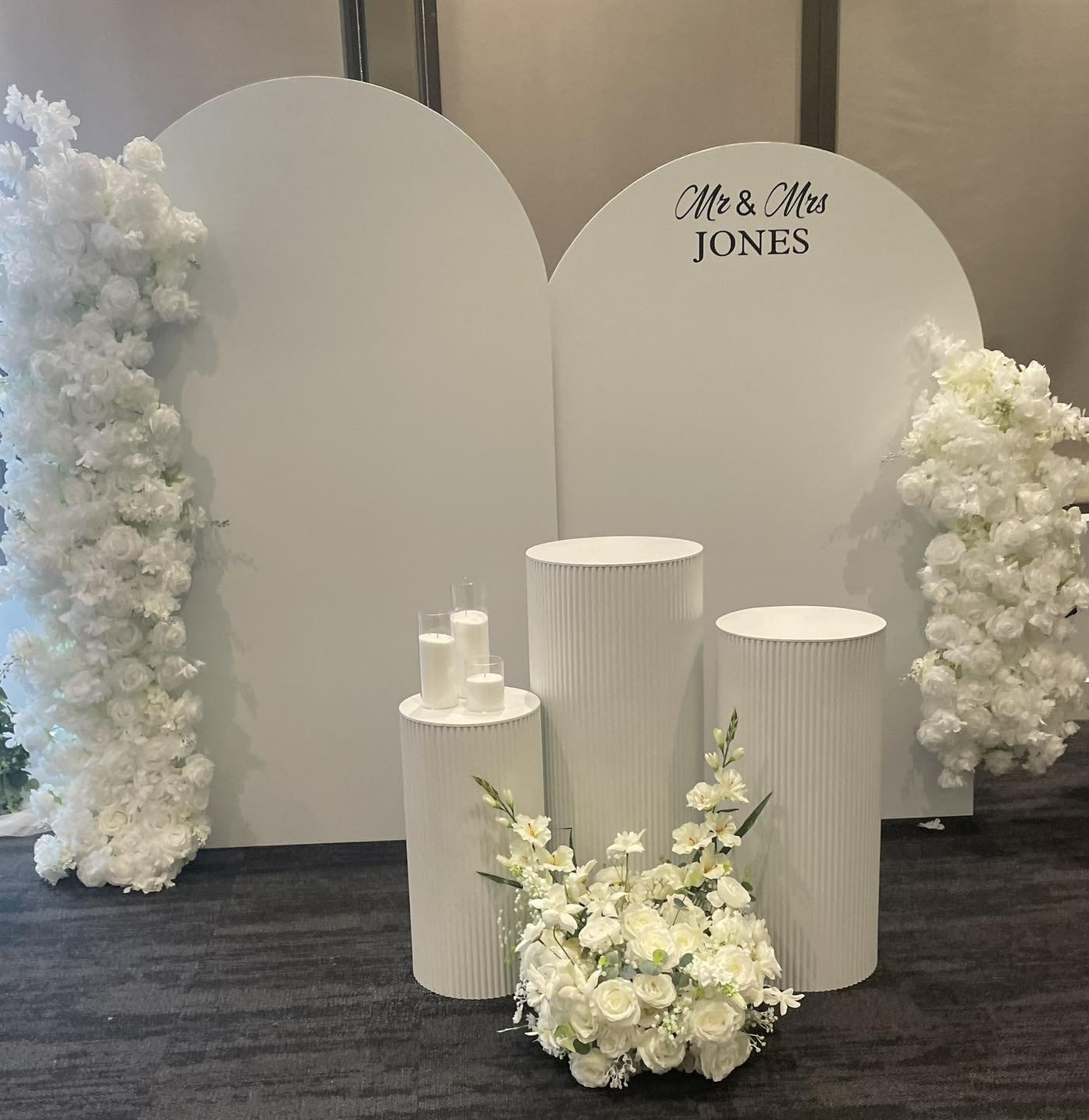 Mr and Mrs arch backdrop with white florals