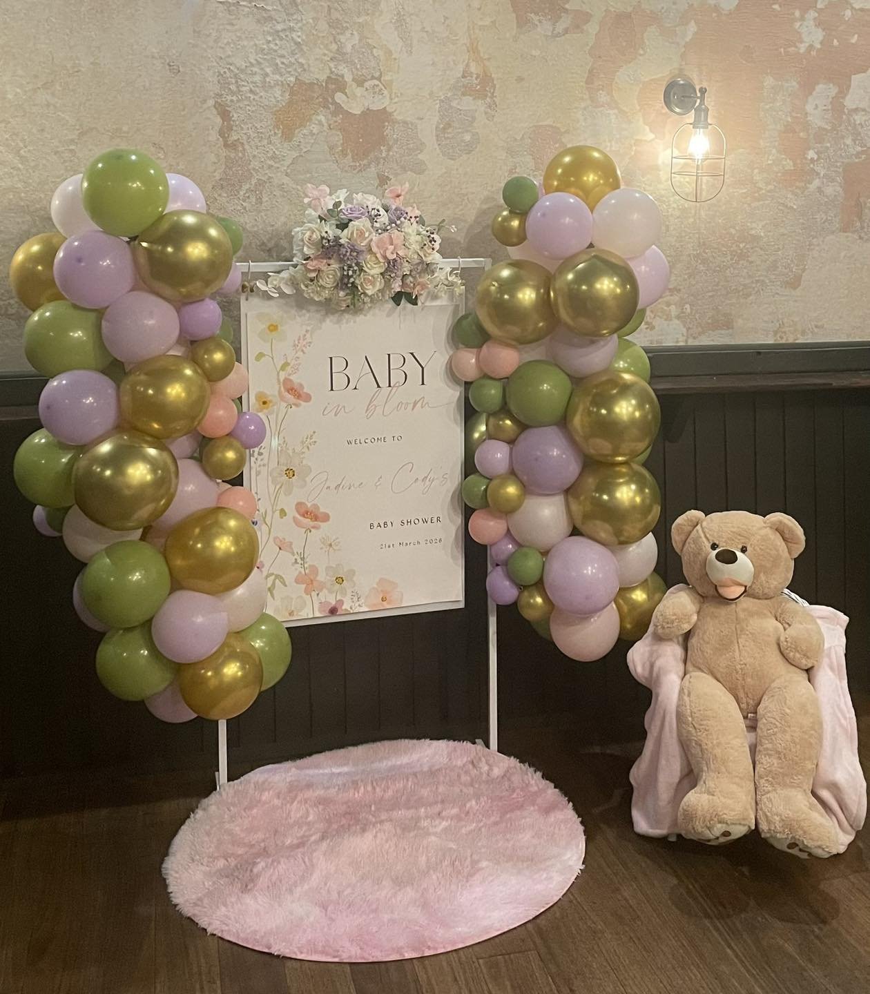 Baby in Bloom welcome backdrop with pastel balloons