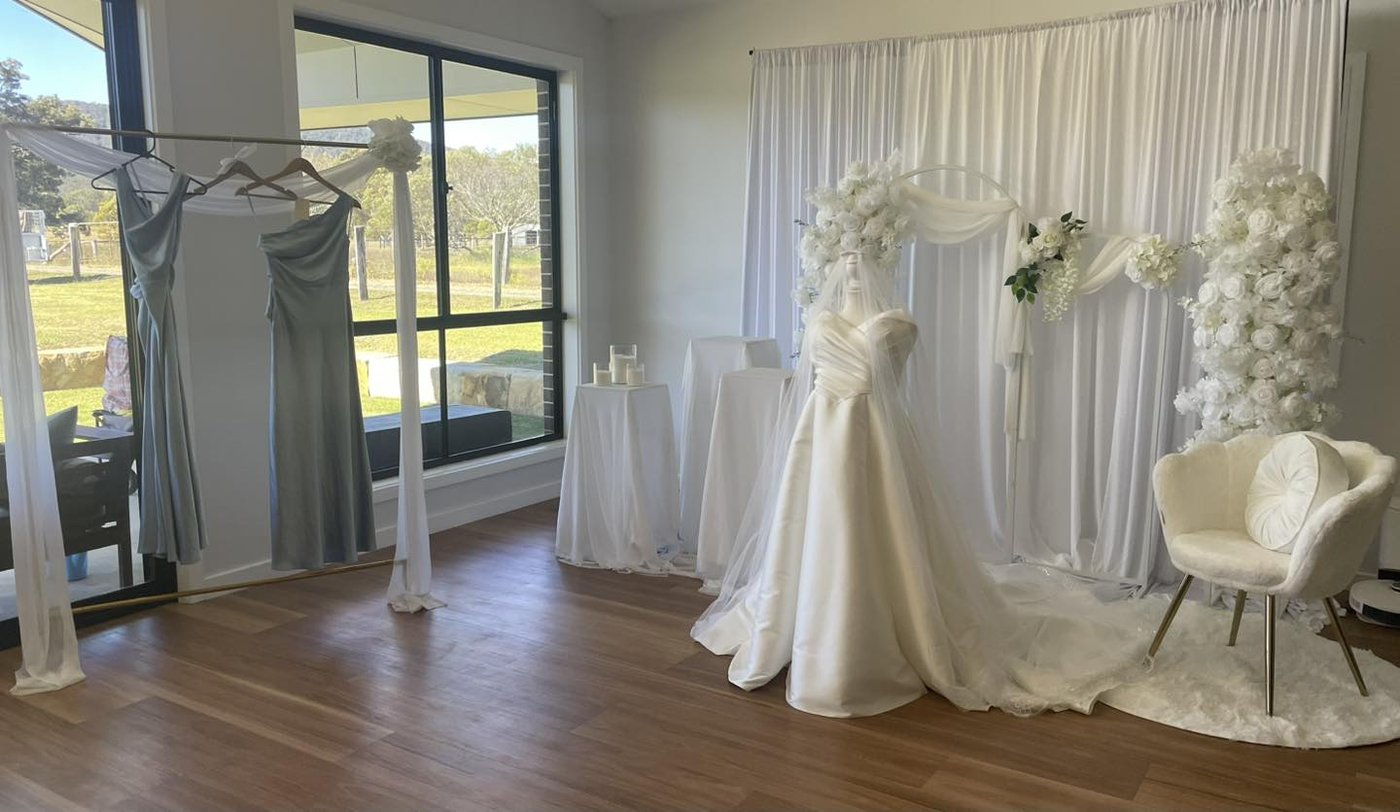 Bridal room with country views and dress display