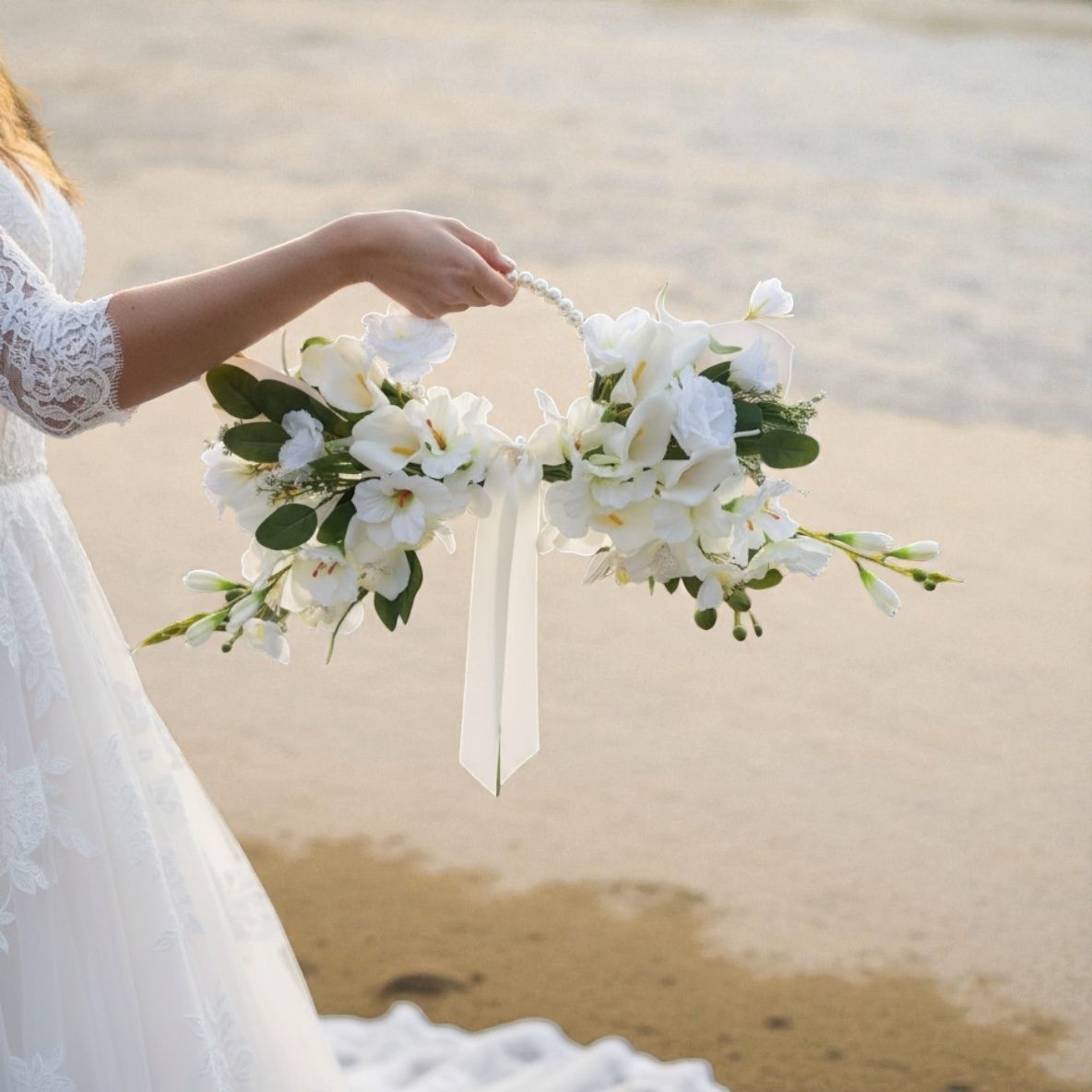 Bride holding a white floral hoop bouquet